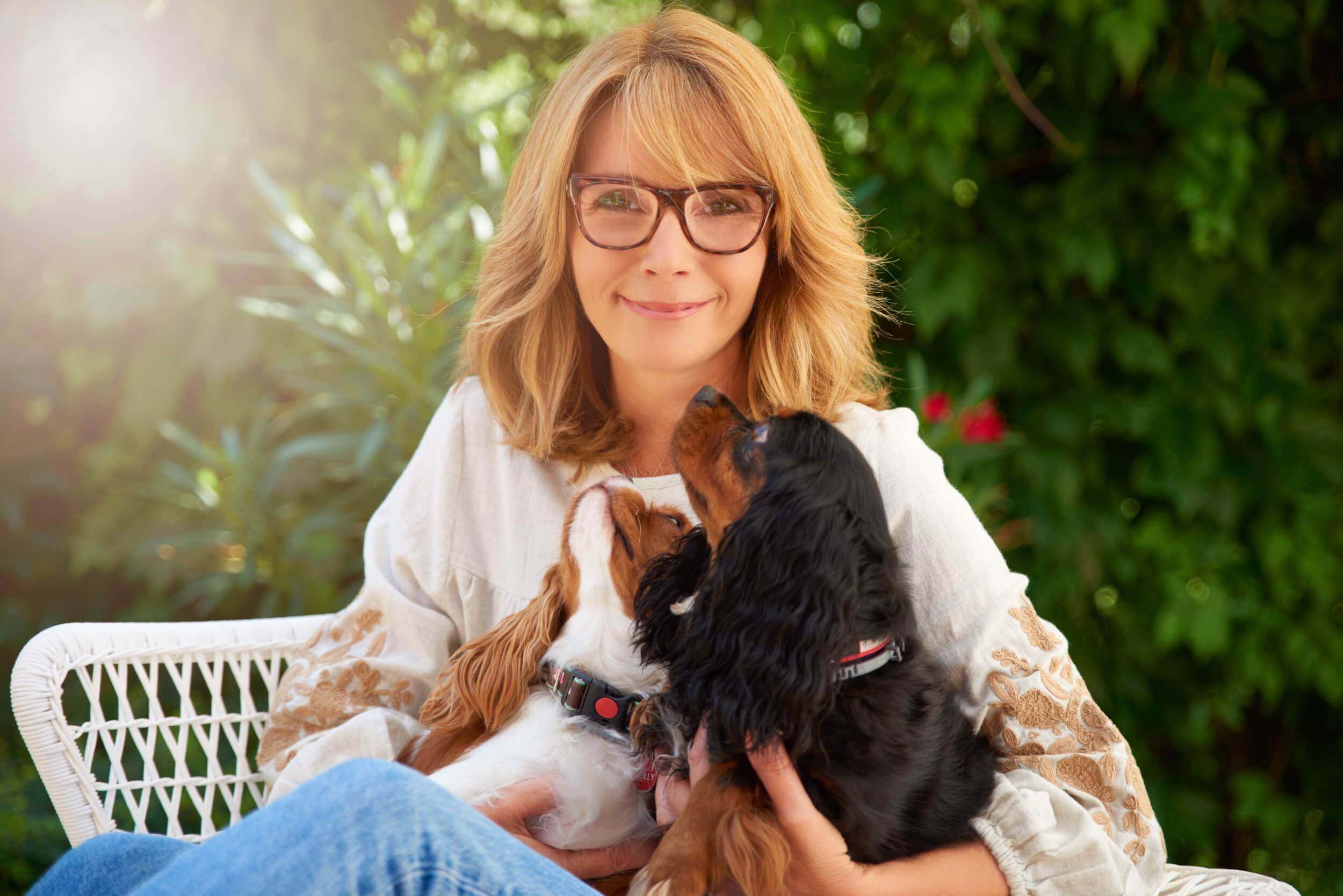 Built for Breeders, Managed by Us Dog breeder with her Cavalier King Charles Spaniels